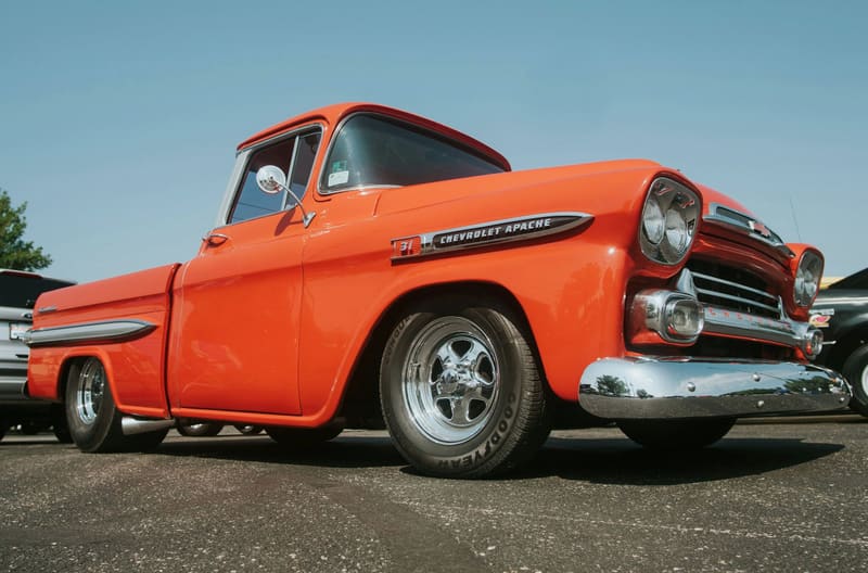 A restored orange Chevrolet Apache pickup