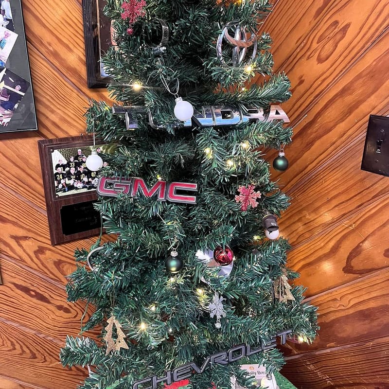 The shop Christmas tree, hung with car emblems